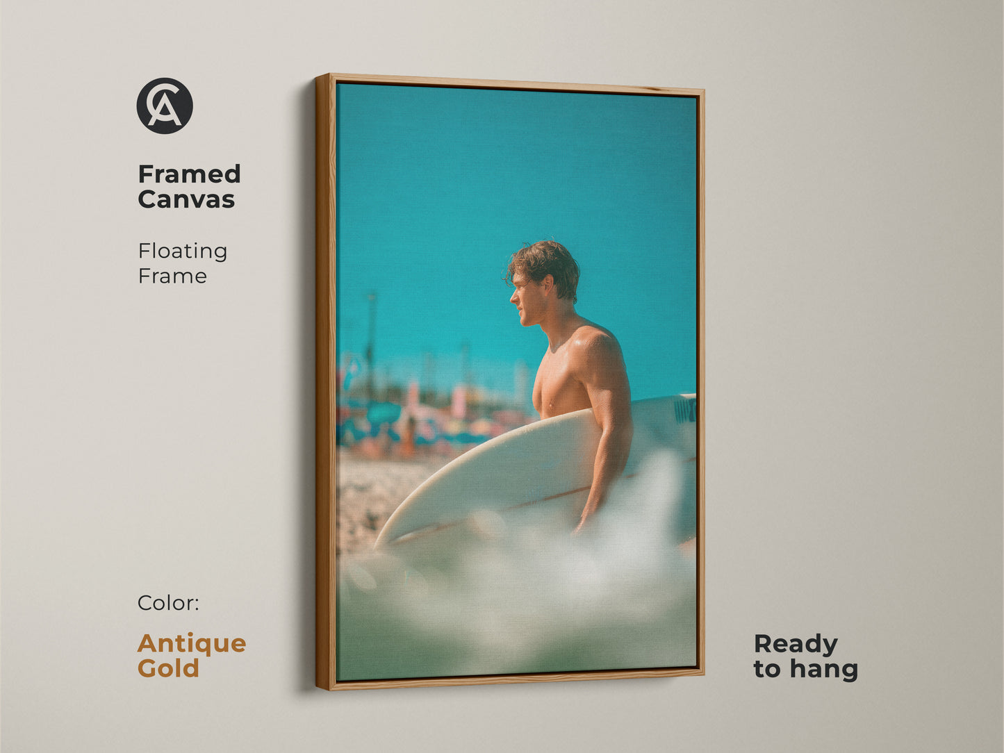 Framed canvas artwork featuring a surfer. The floating frame is antique gold color. The artwork captures a man holding a surfboard on a sunny beach. Ready to hang this framed art in your home.