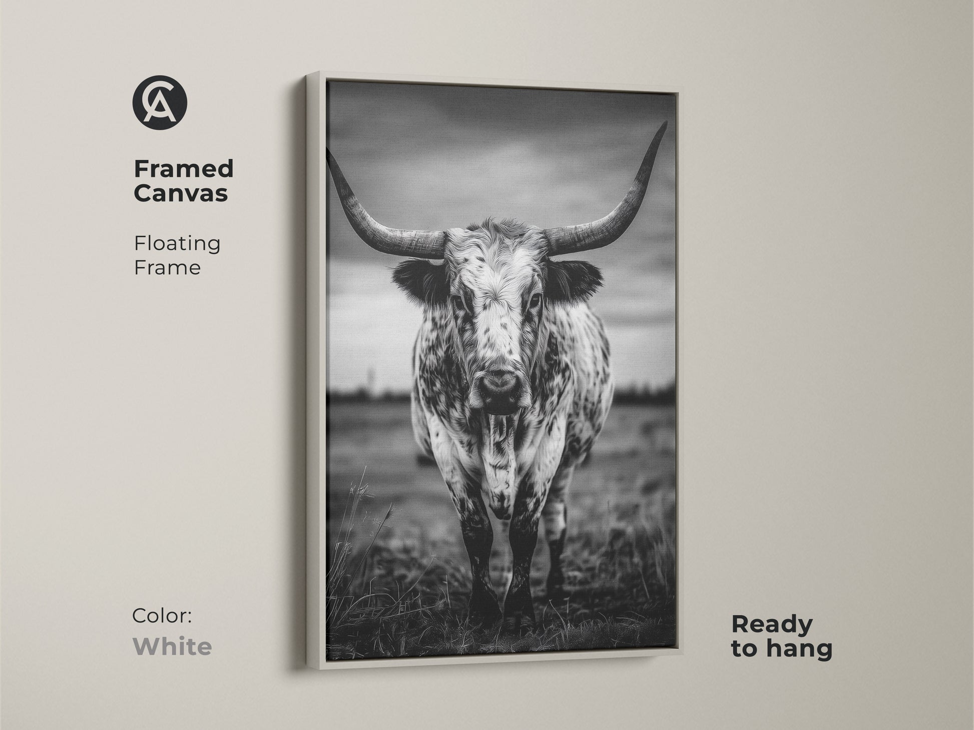 Framed canvas featuring a black and white Texas Longhorn in a floating white frame. This ready-to-hang animal portrait canvas adds character to entryways living rooms or home offices. The rustic ranch decor complements farmhouse or minimalist interiors. It brings a touch of the wild west to any residential space making it an excellent housewarming gift.