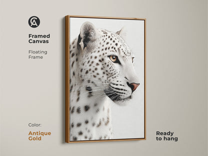 A framed canvas in antique gold features a snow leopard face in black and white. This ready to hang wildlife artwork enhances modern homes. Ideal gift for wildlife enthusiasts and animal art collectors.