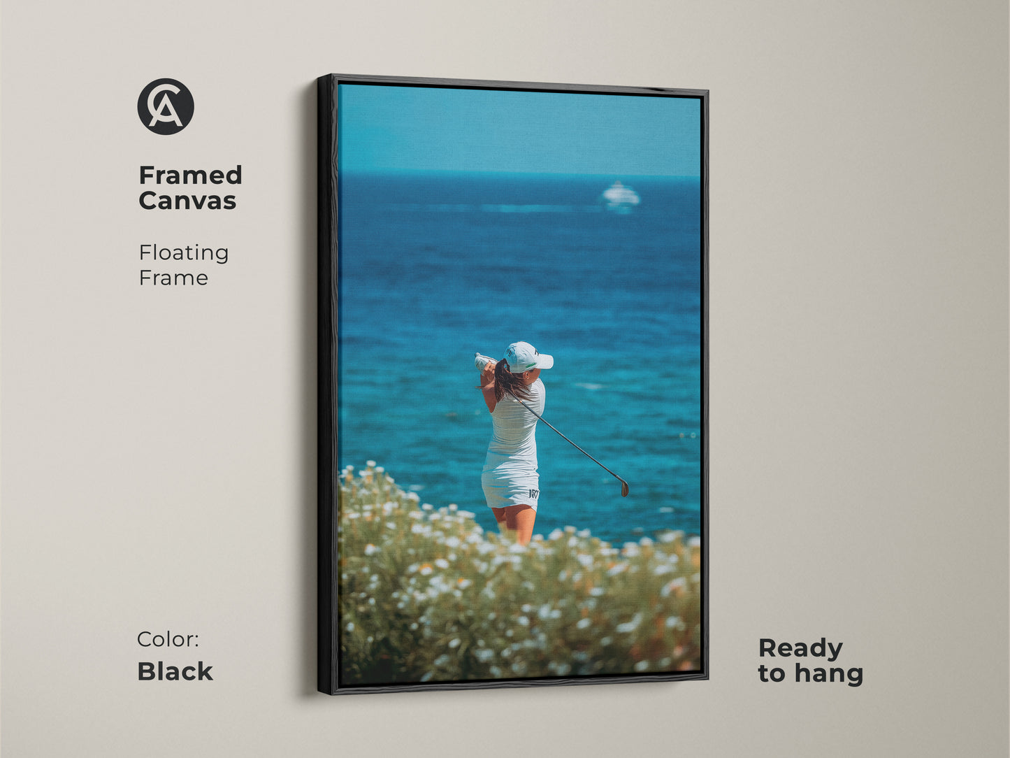 Framed canvas art of a woman golfer. The artwork is displayed in a sleek black floating frame. It showcases a golfer swinging her club with the ocean in the background. It is ready to hang and enjoy in any room.