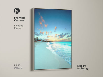 White floating frame enhances this framed canvas print. Ocean waves wall art captures the essence of a seaside sunset. This canvas is ready to hang and enjoy.