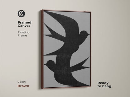 Framed canvas of minimalist wall art featuring an abstract black swallow flock. The floating frame color is brown. This modern grey nature decor is ready to hang. This is perfect as bedroom wall art or a housewarming gift canvas for minimalist homes.