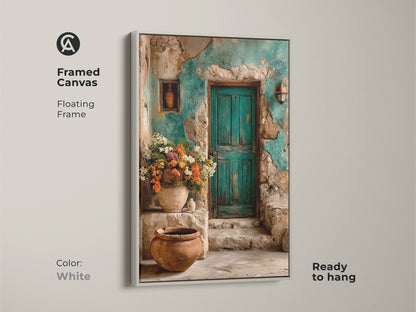 Framed canvas in white featuring boho floral wall art. A rustic teal door and vibrant flowers create Mediterranean home decor. Perfect as a travel lovers gift print this botanical scene canvas is ready to hang adding old world charm.