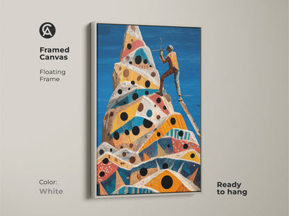 A framed canvas with a floating white frame features surreal mountain climb art. An abstract geometric peak shows an adventurer figurine. Ready to hang cobalt blue yellow orange artwork complements modern interiors.