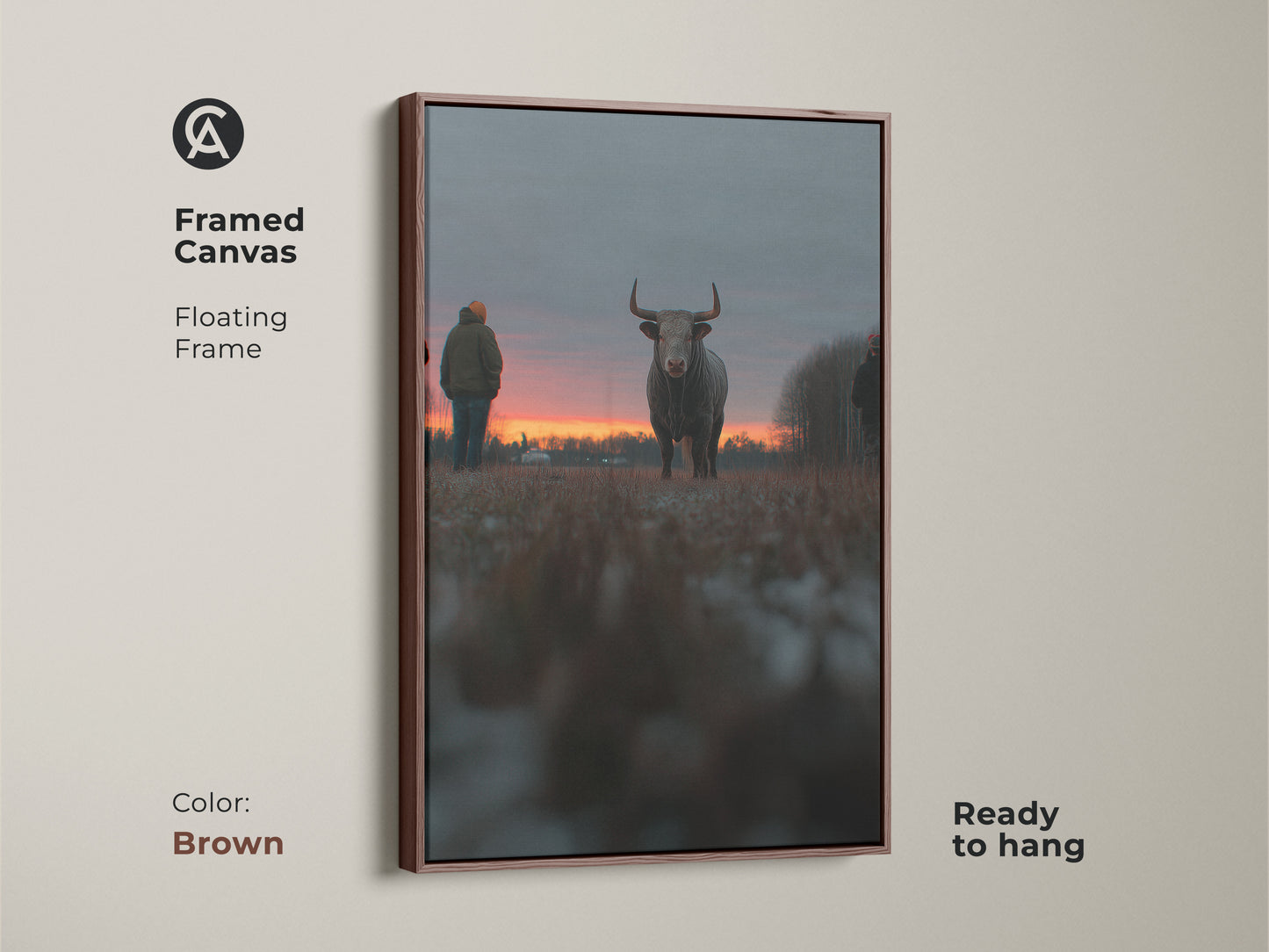 Framed canvas artwork of a bull at sunset with a floating brown frame. This ready-to-hang piece is ideal for farmhouse wall decor. The rustic animal art enhances any bedroom. This orange red gray art is a perfect gift for farm lovers. The brown frame adds a rustic touch