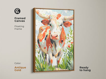Framed canvas art featuring a longhorn cow. The antique gold floating frame elevates the artwork. Orange white and cream colors create a vibrant palette. Green touches add freshness. Ready to hang.