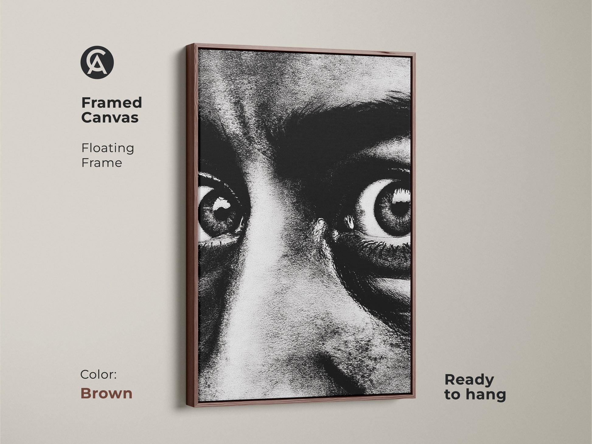 Framed canvas of a monochrome face portrait with a brown floating frame. Ready to hang this intense gaze canvas art adds a contemporary touch. The expressive eyes artwork is perfect for modern monochrome decor. Enhance your entryway with this bold black and white print.