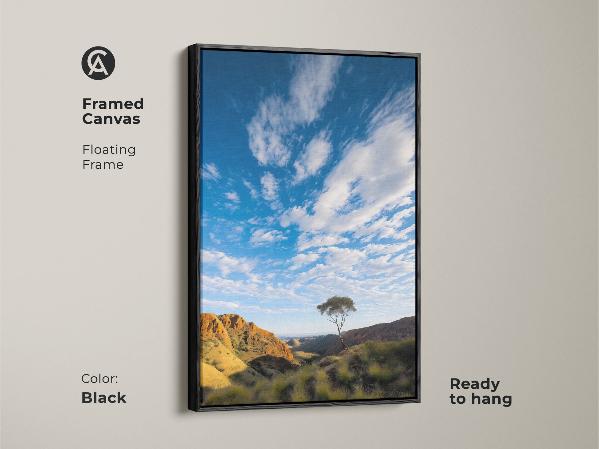 Framed canvas featuring a photorealistic Australian Outback landscape. This scenic mountain artwork includes a lone tree and a blue sky nature print. The black floating frame adds a contemporary touch. Ready to hang this wall decor is perfect for residential or office spaces.