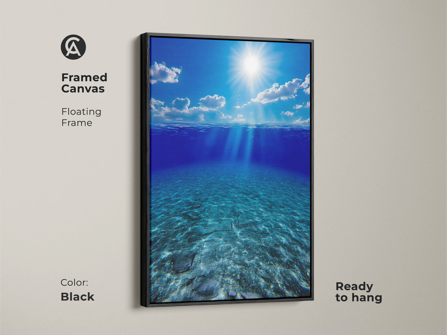 Framed canvas of underwater sunbeams in deep blue ocean with a black floating frame. This ready-to-hang artwork offers calming blue wall art for any room. The photorealistic seascape brings a touch of the beach to your home. A beautiful housewarming gift.