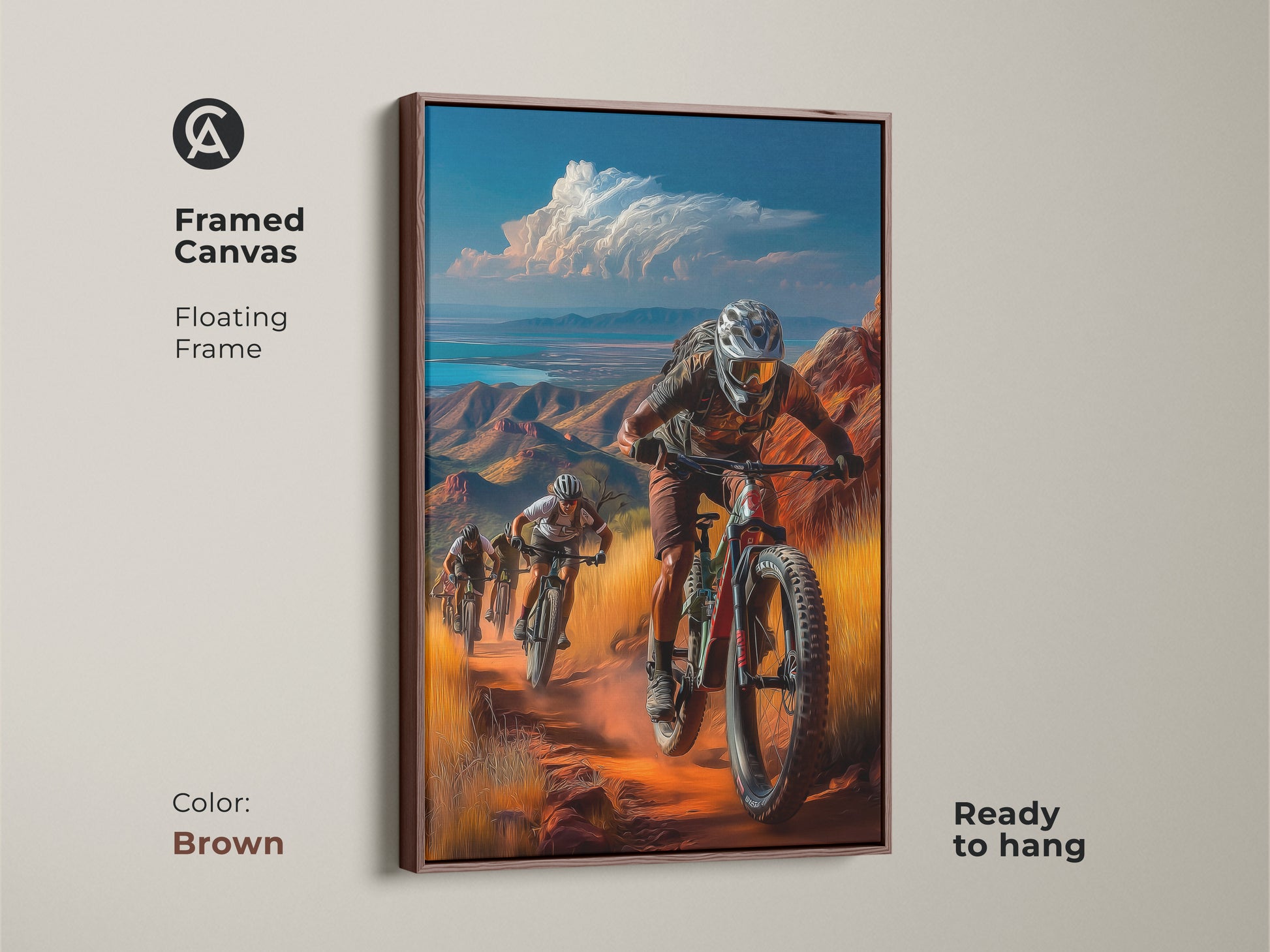 Framed brown canvas featuring mountain bikers descending a desert trail. Contemporary artwork with a floating frame adds a warm tone. This cyclist gift wall art will complement your living space.