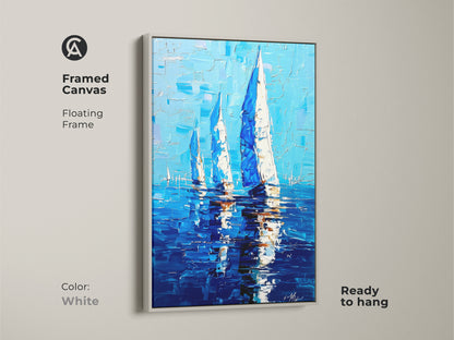 Framed canvas of sailboat artwork in a white floating frame. The coastal seascape print is nautical wall decor. The deep blue ocean painting is ready to hang. This sailing boat artwork in blue and white canvas adds an ocean view. This art is a perfect nautical housewarming gift.