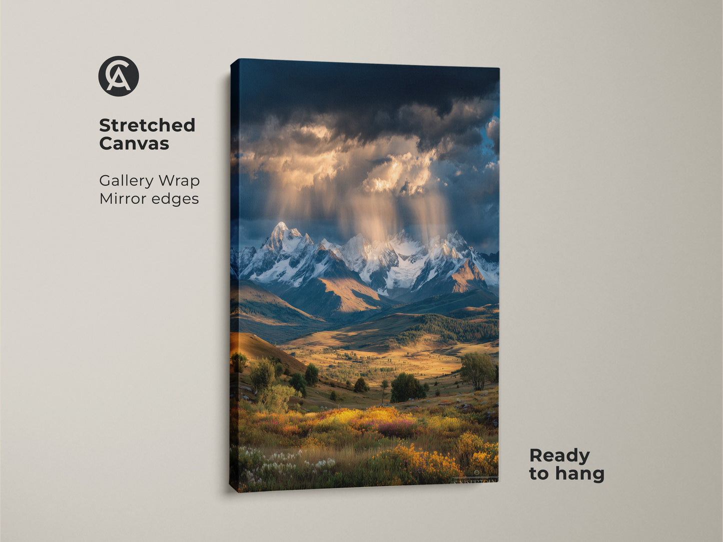 A stretched canvas print showcases a mountain landscape. Gallery wrapped with mirrored edges it's ready to hang. Snowy mountains wildflowers and golden light create stunning wall art. Ideal for modern farmhouse or rustic cabin decor.