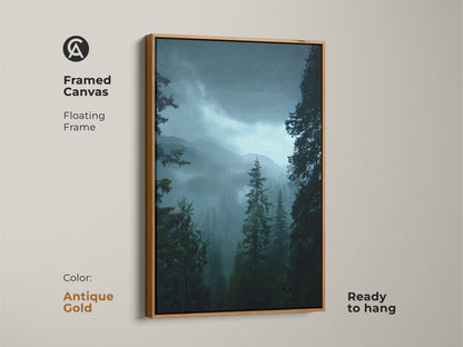 Framed canvas print of a misty mountain scene with an antique gold frame. This pine tree forest artwork adds elegance to your walls. The deep green nature art is ready to hang. Perfect for a serene rustic bedroom decor.