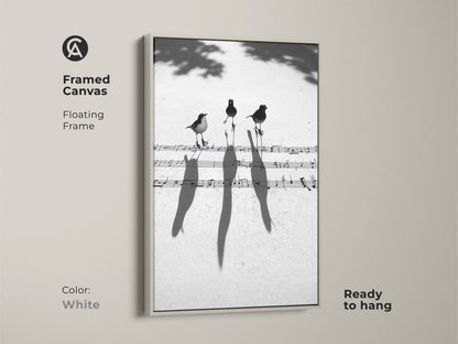 White framed canvas featuring a minimalist birds on music notes art print. The floating frame contemporary artwork is ready to hang. A unique gift for music enthusiasts.