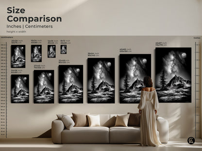 Size comparison featuring a woman admiring monochrome mountain art above a sofa. Available in multiple sizes as canvas or poster. This black and white landscape art features a moonlit pine tree.