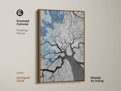 Modern canvas in an antique gold frame featuring an abstract tree. Blue hues and line art create a sophisticated print. This oak tree artwork is perfect for any room. Ready to hang this canvas makes a great housewarming gift. The floating frame adds a touch of elegance to this minimalist art.