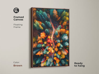Framed canvas of an aerial autumn forest. This beautiful landscape art is showcased in a brown floating frame. The warm tones of the forest complement the frame. Ready to hang and adds a touch of nature to your space.