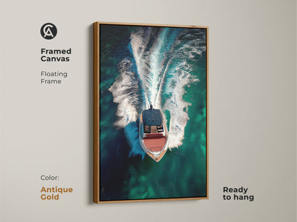 Framed canvas showcasing aerial speedboat artwork with an antique gold floating frame. The emerald green ocean wall art highlights turquoise waters. Ready to hang this contemporary nautical art is ideal office wall decor.
