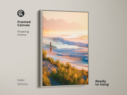 White framed canvas art. The artwork presents a surfer on the beach during sunrise. Floating frame complements the image. Ready to hang. This white framed canvas adds a fresh touch to your decor.