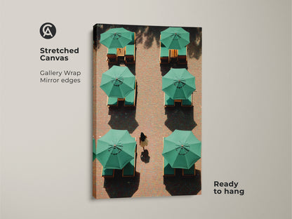 This stretched canvas features minimalist green umbrella artwork. Gallery wrapped with mirrored edges it is ready to hang. This contemporary travel lifestyle canvas art brings a modern aesthetic. Perfect for any living space. A great housewarming gift.