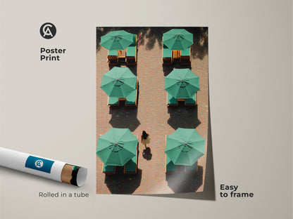 Minimalist travel canvas art is presented as a poster print. Rolled in a tube this contemporary lounge art is easy to frame. The green umbrellas offer a modern aesthetic. It's a unique housewarming gift for travelers.