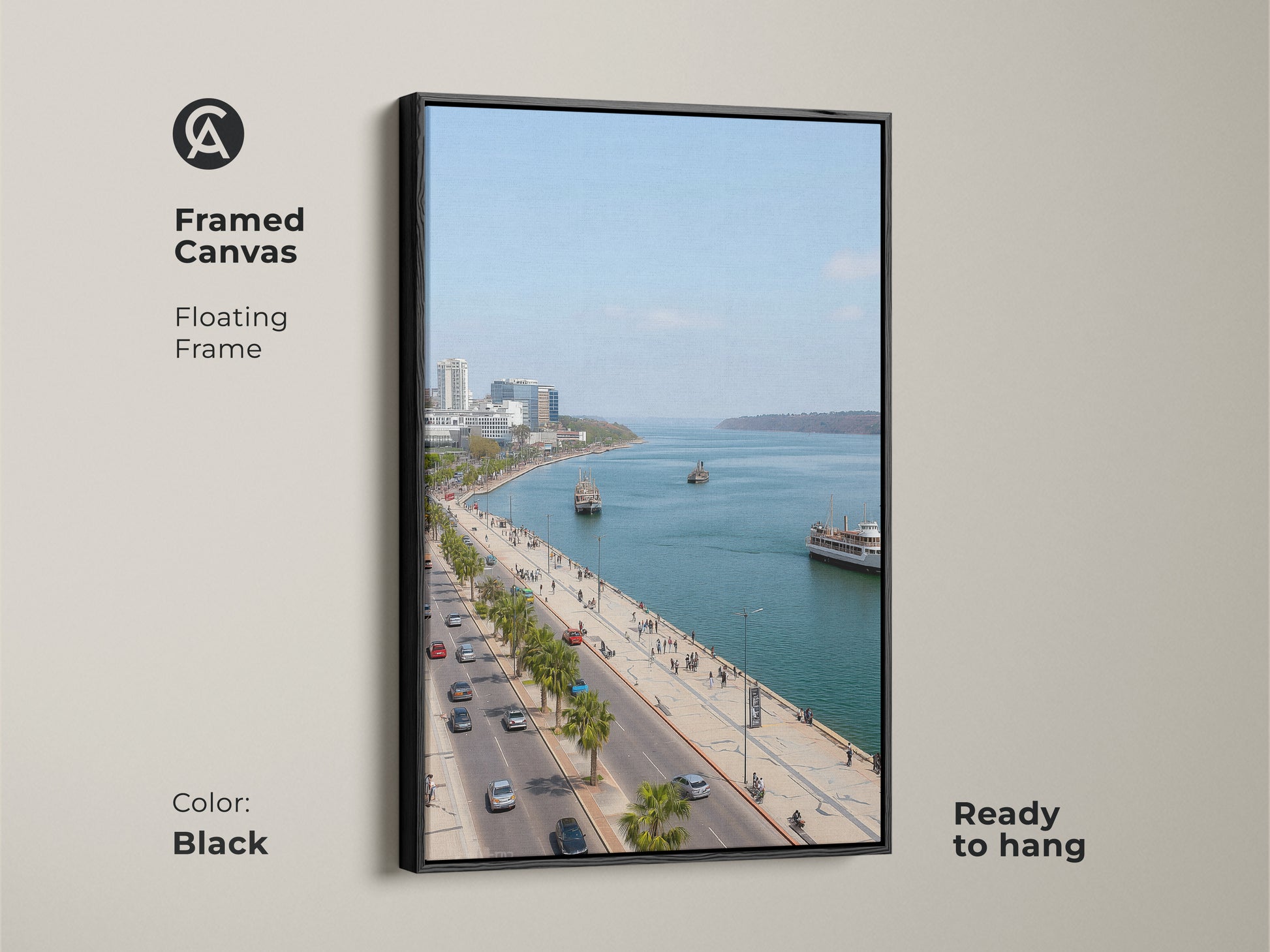 Framed canvas artwork featuring a blue teal coastal cityscape. The black floating frame enhances the travel photography. Palm trees line the street. Perfect for entry hall decor. Contemporary seaside art.