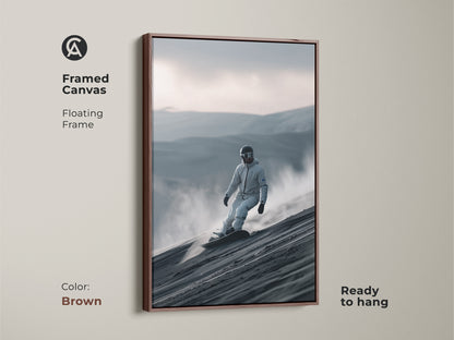 Framed canvas print of a snowboarder in action. The brown floating frame complements the artwork. This ready-to-hang piece captures a snowboarder riding a sand dune. Perfect for adding a sporty touch. A unique wall decor choice.
