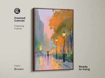 Framed canvas art in a brown floating frame. This impressionist artwork showcases a person with an umbrella and glowing street lamps. The expressive cityscape is ready to hang. The contemporary art adds color and mood to any room.