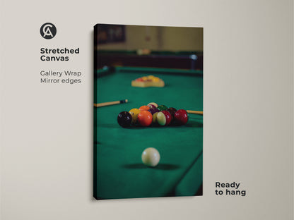 Stretched canvas shows billiard balls on a pool table in emerald green. This gallery-wrapped artwork is ready to hang. It's ideal game room decor and a unique man cave gift. The billiard balls canvas print enhances any leisure room.