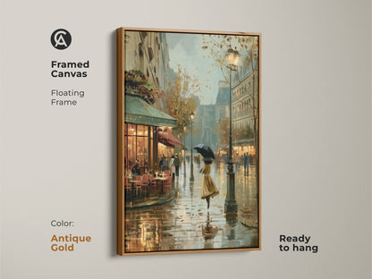 Framed canvas art of a rainy Paris street with an antique gold floating frame. This impressionistic cityscape shows a woman with an umbrella. It's a ready to hang European street scene decor. This artwork adds a touch of vintage elegance to any residential wall.