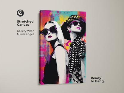 Stretched canvas pop art print showcasing two stylish women in sunglasses. The gallery wrap with mirror edges enhances the abstract magenta and teal background. It is perfect for adding a fashionable touch to a living room or home office. This ready-to-hang canvas art makes a bold statement. It's a unique piece of contemporary artwork.