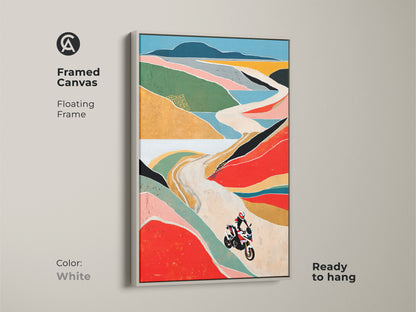 Brighten up your walls with this framed canvas print showcasing a motorcycle on a scenic mountain road. The white floating frame complements the colorful abstract landscape. This vibrant artwork is a perfect addition to any modern home. It is ready to hang.