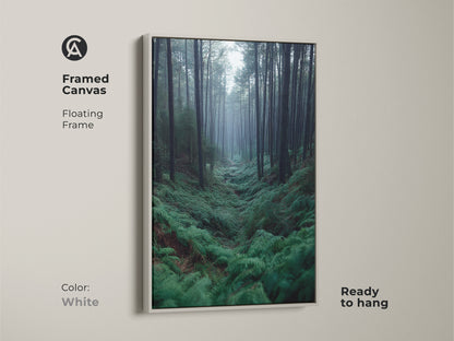 Framed canvas of a Misty Forest scene. This nature artwork has a floating white frame. It's a deep green nature print. Ideal as cozy bedroom wall decor.
