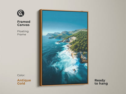 White framed Coastal Cliff Canvas. Features turquoise ocean waves and pine trees. Ready to hang nature seascape artwork. Perfect for coastal bedroom wall decor. A serene ocean view print.