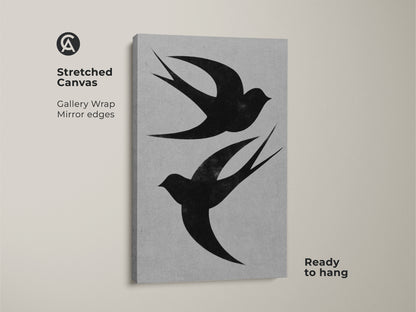 Stretched canvas art showcases a minimalist swallow silhouette. This black and white bird print has gallery-wrapped mirrored edges. It arrives ready to hang adding a modern nature touch to any space. A perfect neutral bedroom art piece.
