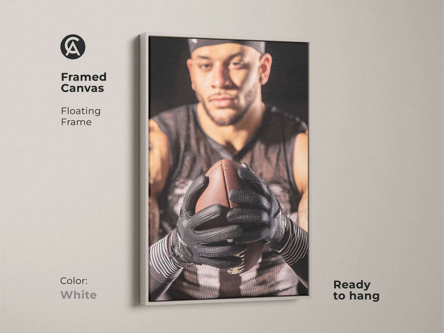 White framed canvas print of an American Football player. The floating frame adds a modern touch to the sports artwork. Ready to hang in a home gym or office. This athlete portrait is a perfect gift for football fans. Add masculine decor to your man cave.