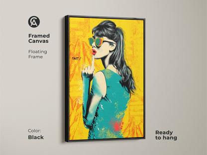 Framed canvas of a pop art woman. It has a black floating frame and is ready to hang. This eclectic fashion decor features a retro style. The yellow orange and teal artwork will make a statement in any entryway. It is a unique piece of art.