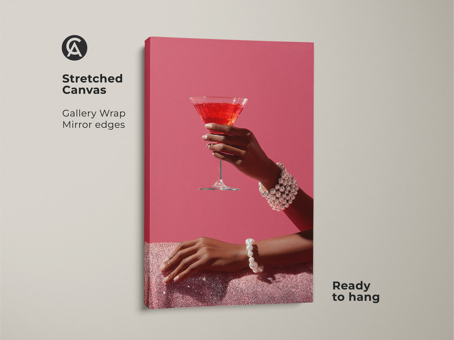 Elevate your home bar with this glam cocktail wall art on stretched canvas. The pink martini art print features a hand with a pearl bracelet. It's a contemporary drink artwork that's ready to hang. Add a sophisticated touch with this modern bar area art. The gallery wrap has mirror edges.
