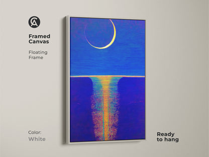 A framed canvas with celestial moon art is featured in deep blue and ochre. The white floating frame complements the abstract night scene. This ready-to-hang piece brings a unique home wall art into your space. 