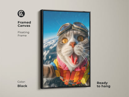 Framed canvas art featuring a skydiving cat. This floating frame is black and ready to hang. The funny cat art is a conversation starter. The unique wall art is a must-have for animal lovers.