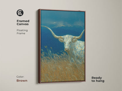 The framed canvas displays the White Longhorn art with a warm brown floating frame. The artwork showcases a longhorn in a field against a mountain backdrop. This ready-to-hang piece brings rustic charm. Elevate your home with this beautiful framed art.