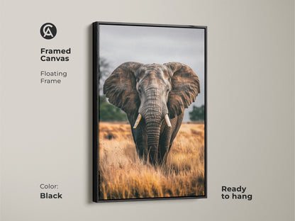 Framed canvas of an elephant portrait in black. This wildlife wall art features a floating frame. The earthy brown and grey tones bring a rustic touch to your living room or bedroom. This ready to hang canvas is a perfect housewarming gift. The photorealistic animal is showcased in its natural habitat.
