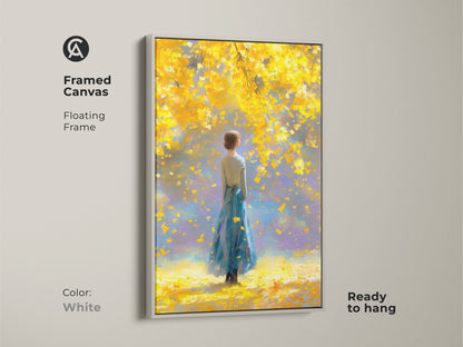 White framed canvas artwork showcasing a woman in a blue dress beneath a bright yellow tree. The floating frame adds a modern touch to the art. Ready to hang this piece provides a seamless and stylish art solution. Transform your space with this elegant artwork.
