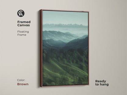 Brown framed canvas displaying a misty mountain landscape. Floating frame highlights this teal green nature artwork. Ready to hang this modern farmhouse decor. It's a perfect housewarming gift for hiker and outdoor lovers. Calming forest view art.