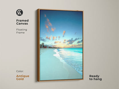 Antique gold floating frame surrounds this framed canvas art. Sky blue and yellow colors highlight the tropical beach scene. Residential beach decor brings a tranquil ocean view.