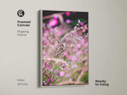 Framed canvas featuring a delicate pink wildflower. White floating frame complements the soft focus nature art. This botanical art print is ready to hang. A serene addition to bedroom wall decor pink.