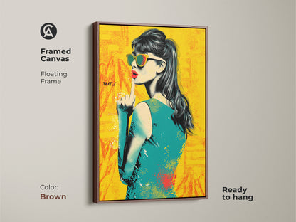 Framed canvas of a pop art woman. It features a brown floating frame and is ready to hang. This vintage woman print has a retro style. The yellow orange and teal colors create a vibrant look. This artwork is great as entryway wall art.