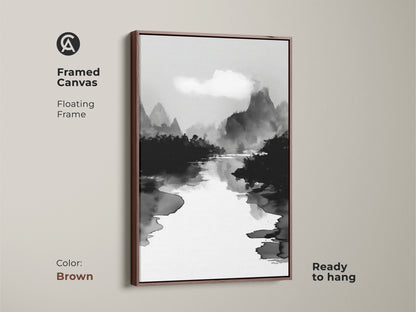 Framed canvas in brown showcasing a black white ink wash art print. This minimalist mountain river landscape canvas is perfect for Japandi bedroom decor. The Japanese Sumi-e style artwork brings a calming effect. The fine art landscape print enhances any room with its monochrome beauty.