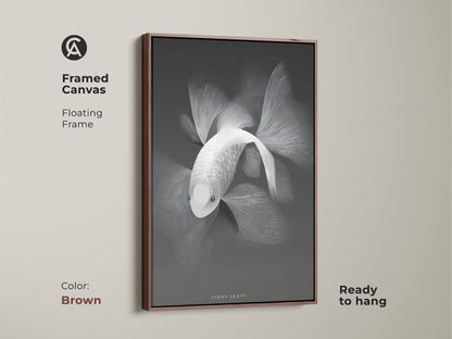 Monochrome fish artwork displayed in a framed canvas. The floating frame is a brown color that enhances the art. The canvas is ready to hang. It's an elegant addition to any interior. Browse framed canvas artwork for a refined aesthetic.
