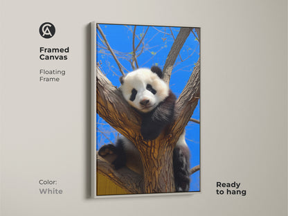 White framed canvas of a panda in a tree. This ready to hang artwork features a photorealistic animal. The blue sky and cute panda enhance any room. A great gift for wildlife art lovers.